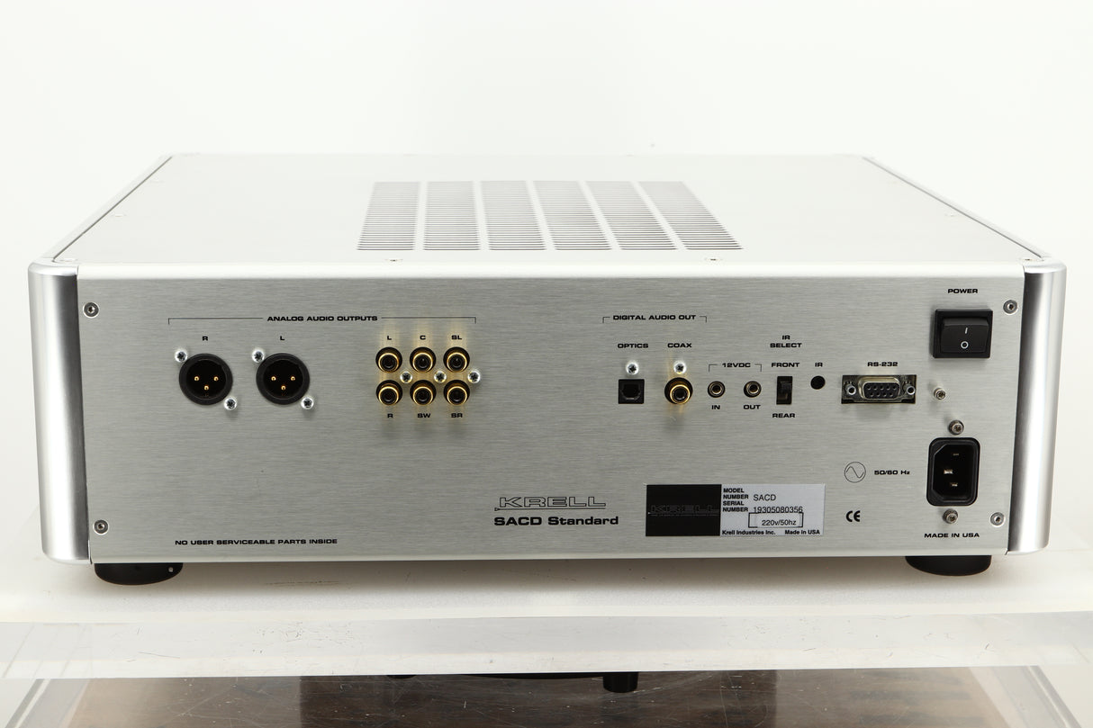 Rear view of a used Krell SACD Standard CD Player in Silver finish showing optical, coax, XLR, and RCA outputs and mains input