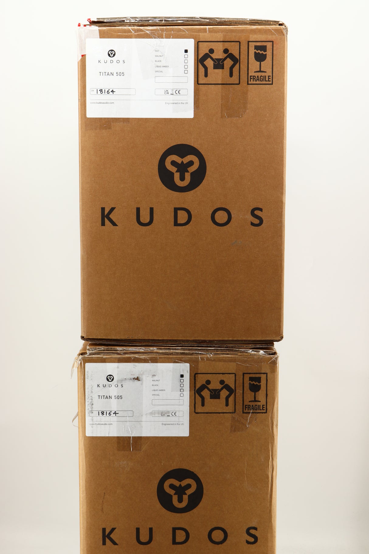 Boxes of a used pair of Kudos Titan 505 Standmount Speakers in Oak finish