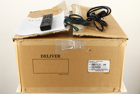 Box of a used Leak CDT CD Transport in Walnut finish with mains cable, manual, remote, and Coax cable 