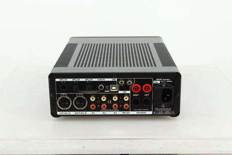 Rear view of a used Leema Acoustics Elements Integrated Amplifier in silver finish showing optical, balanced XLR, RCA, and mains inputs, and speaker outputs