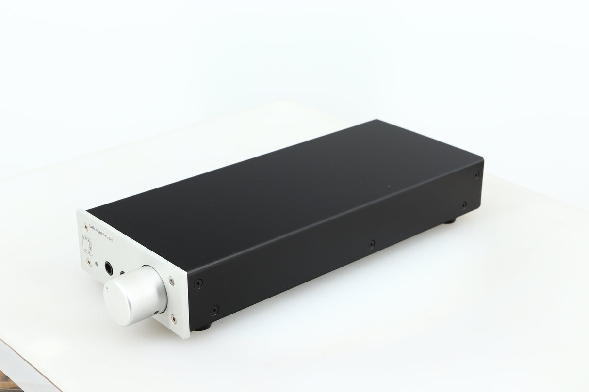 Front right corner of a used Lehmann Black Cube Linear Headphone Amplifier in a silver finish