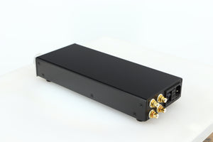 Rear right corner of a used Lehmann Black Cube Linear Headphone Amplifier in a silver finish