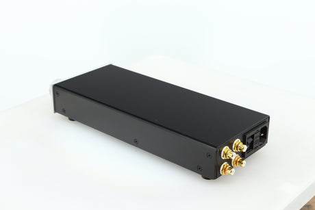 Rear right corner of a used Lehmann Black Cube Linear Headphone Amplifier in a silver finish