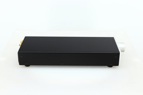 Left side view of a used Lehmann Black Cube Linear Headphone Amplifier in a silver finish