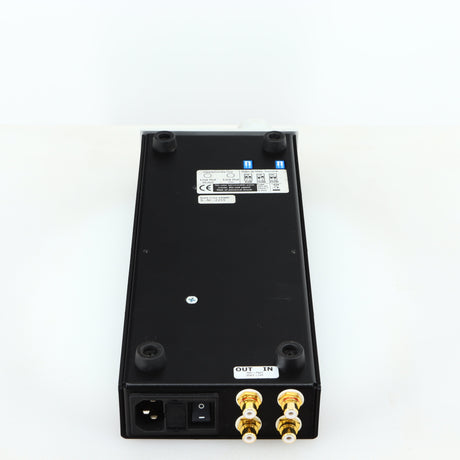 Underside of a used Lehmann Black Cube Linear Headphone Amplifier in a silver finish showing serial number