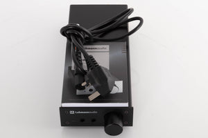 Top of a used Lehmann Linear Headphone Amplifier in a Black finish showing Manual and Mains Cable