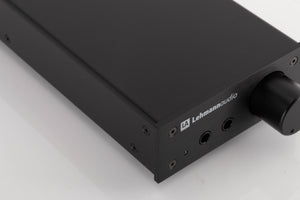 Front left corner of a used Lehmann Linear Headphone Amplifier in a Black finish