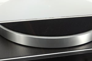 Close up of a used Linn Basik Turntable / Akito Tonearm in a black finish showing a scratch on the rear of the lid