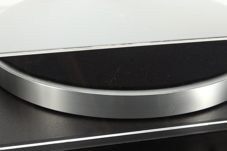 Close up of a used Linn Basik Turntable / Akito Tonearm in a black finish showing a scratch on the rear of the lid