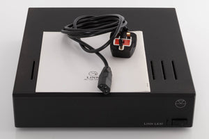 Top of a used Linn LK85 Power Amplifier in a Black finish showing Mains Cable and Manual
