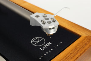 Close up of a used Linn LP12 Akurate Turntable / Ekos SE Tonearm / Krystal Cartridge in a walnut finish showing the cartridge