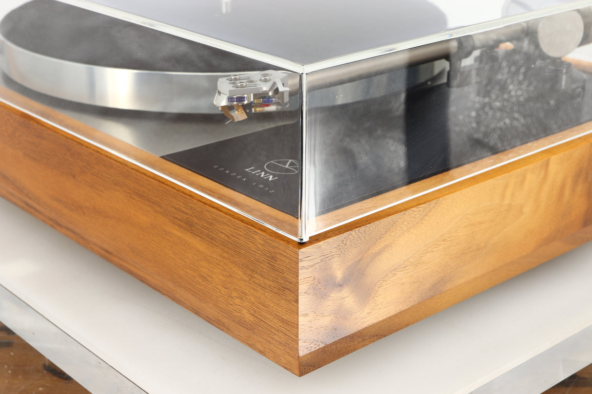 Front right corner of a used Linn LP12 Akurate Turntable / Ekos SE Tonearm / Krystal Cartridge in a walnut finish