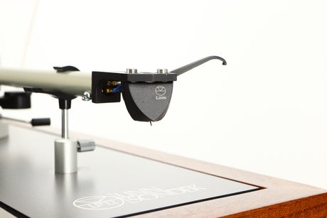 Close up of a used Linn LP12 / Ittok Tonearm / Adikt Cartridge in an afromosia finish showing stylus