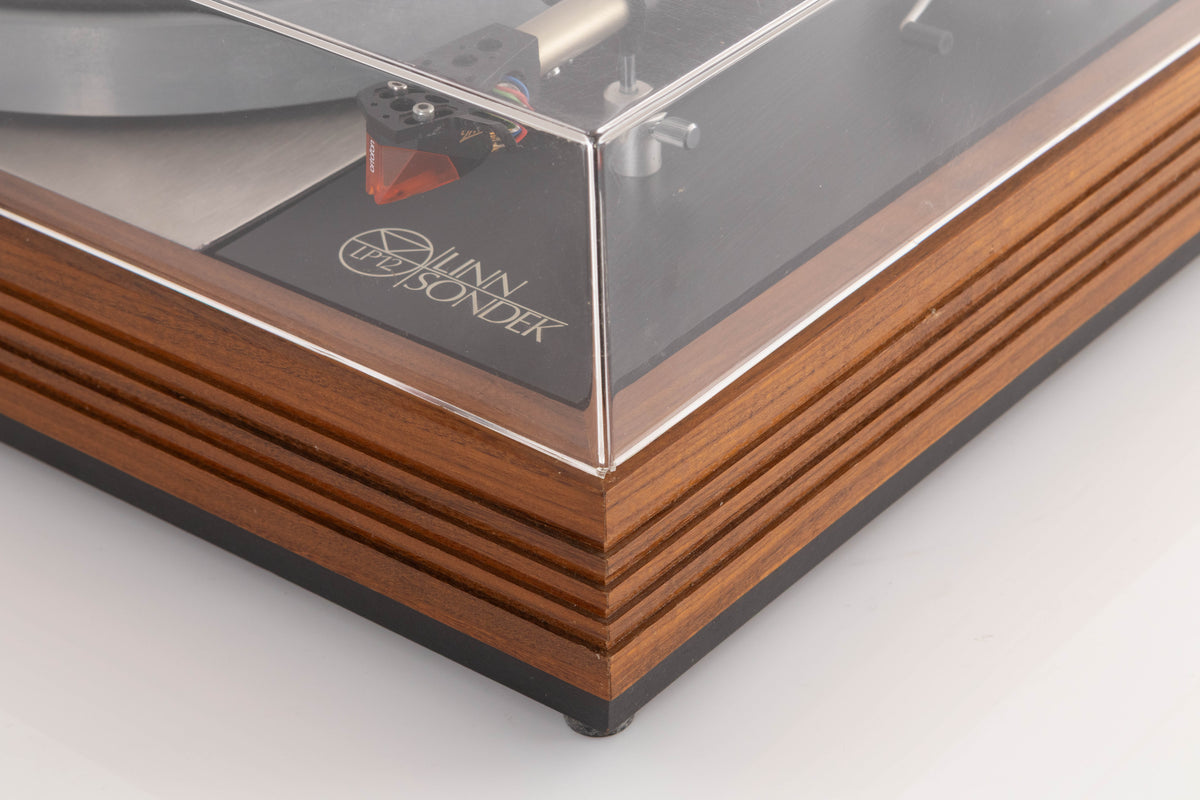 Front right corner view of a Linn LP12 Turntable in Afromosia with Ittok LVII Tonearm and Ortofon 2M Bronze Cartridge