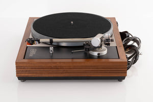 Side view of a Linn LP12 Turntable in Afromosia with Ittok LVII Tonearm and Ortofon 2M Bronze Cartridge