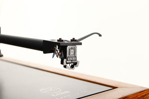 Close up of a used Linn LP12 Turntable / Akito Tonearm / Grado Prestige Blue Cartridge in an afromosia finish showing stylus