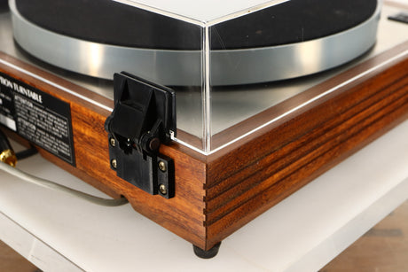Rear left corner of a used Linn LP12 Turntable / Akito Tonearm / Grado Prestige Blue Cartridge in an afromosia finish