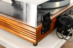 Rear right corner of a used Linn LP12 Turntable / Akito Tonearm / Grado Prestige Blue Cartridge in an afromosia finish