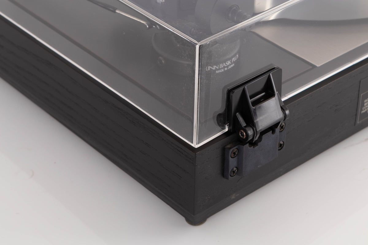 Rear right corner of a used Linn LP12 Turntable / Basik Plus Tonearm / K-9 Cartridge in a Black Ash finish