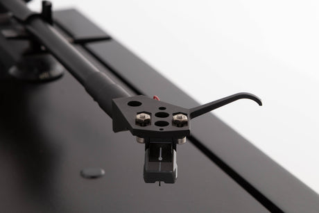 Close up of a used Linn LP12 Turntable / Basik Plus Tonearm / K-9 Cartridge in a Black Ash finish showing stylus