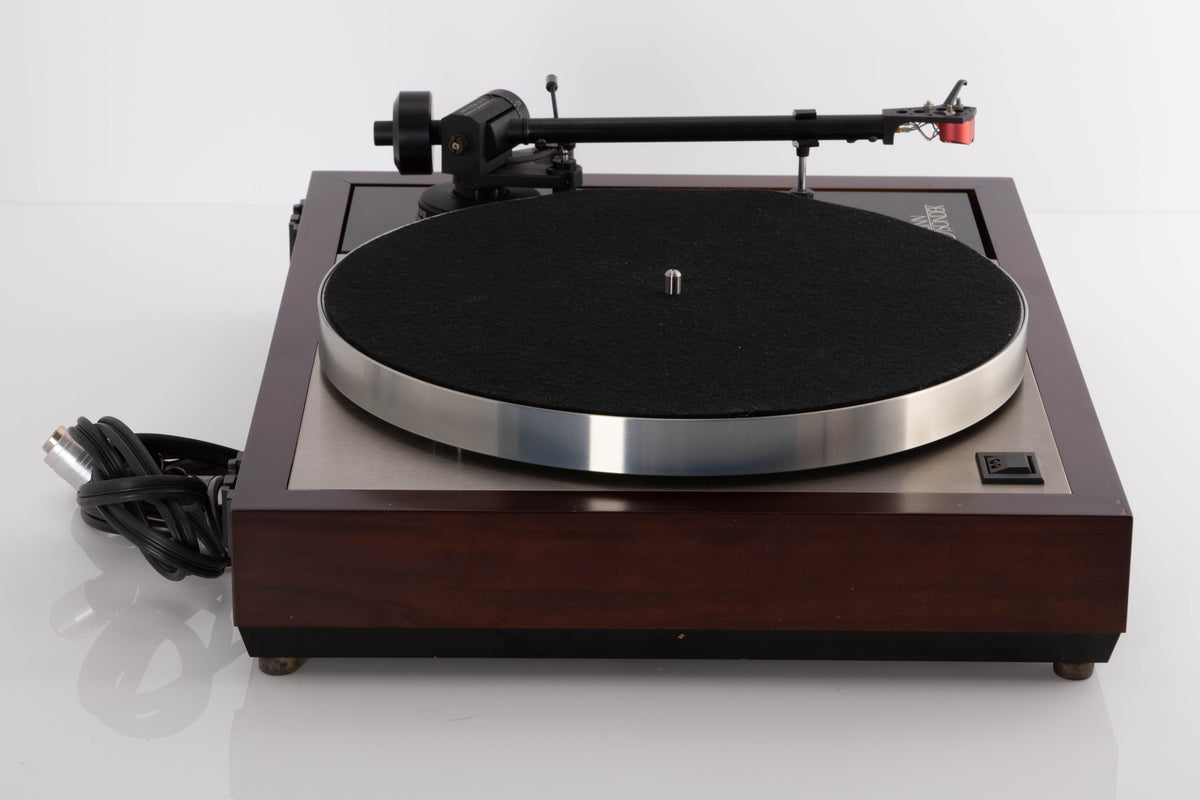Side view of a used Linn LP12 Turntable with Black Ittok Tonearm and Troika Cartridge