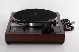 Side view of a used Linn LP12 Turntable with Black Ittok Tonearm and Troika Cartridge