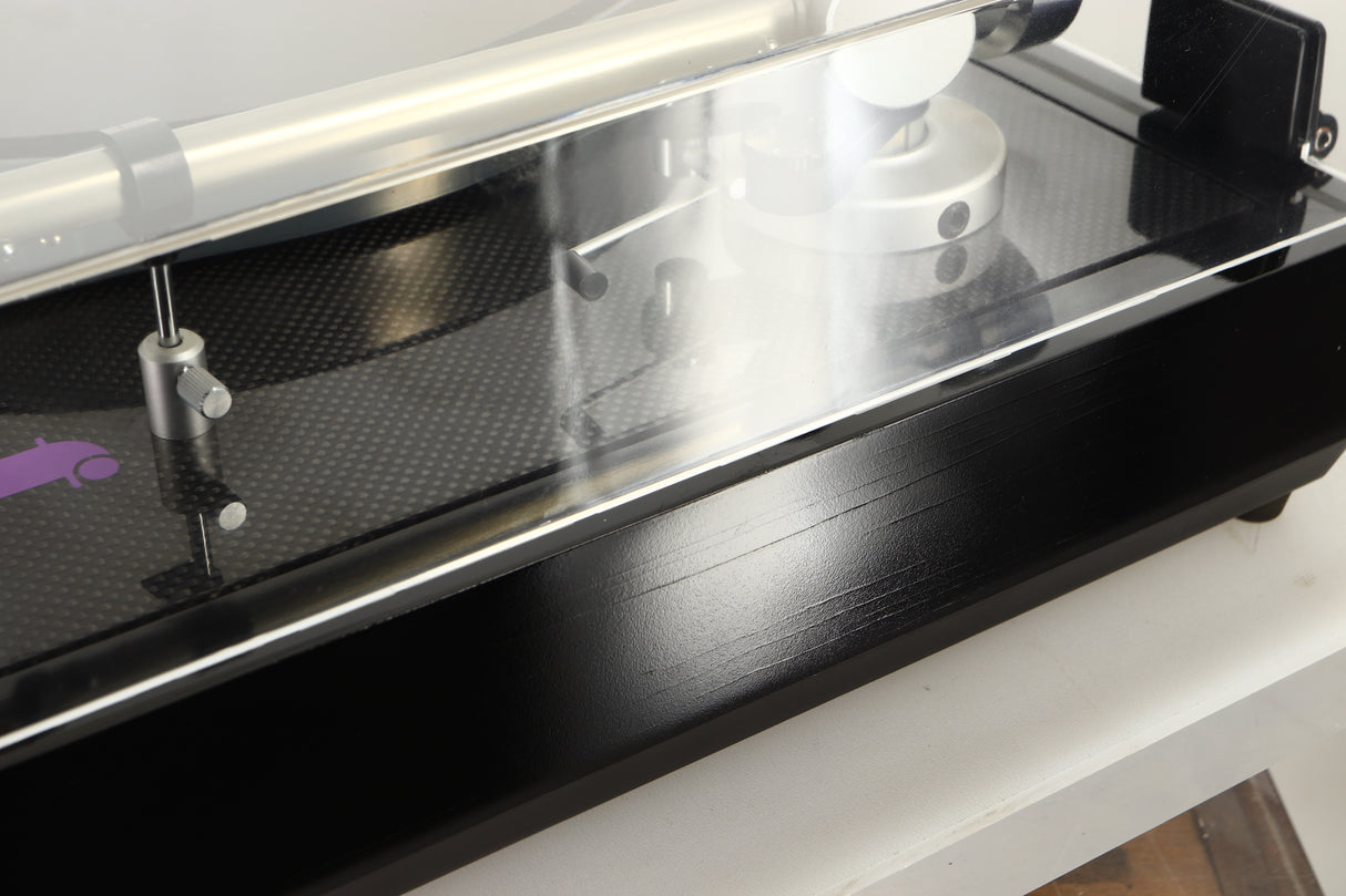 Close up view of a Linn LP12 Turntable in Black Gloss finish with Funk Firm Vector Link Upgrade, Ittok Tonearm, and Dynavector Karat D17D3 Cartridge