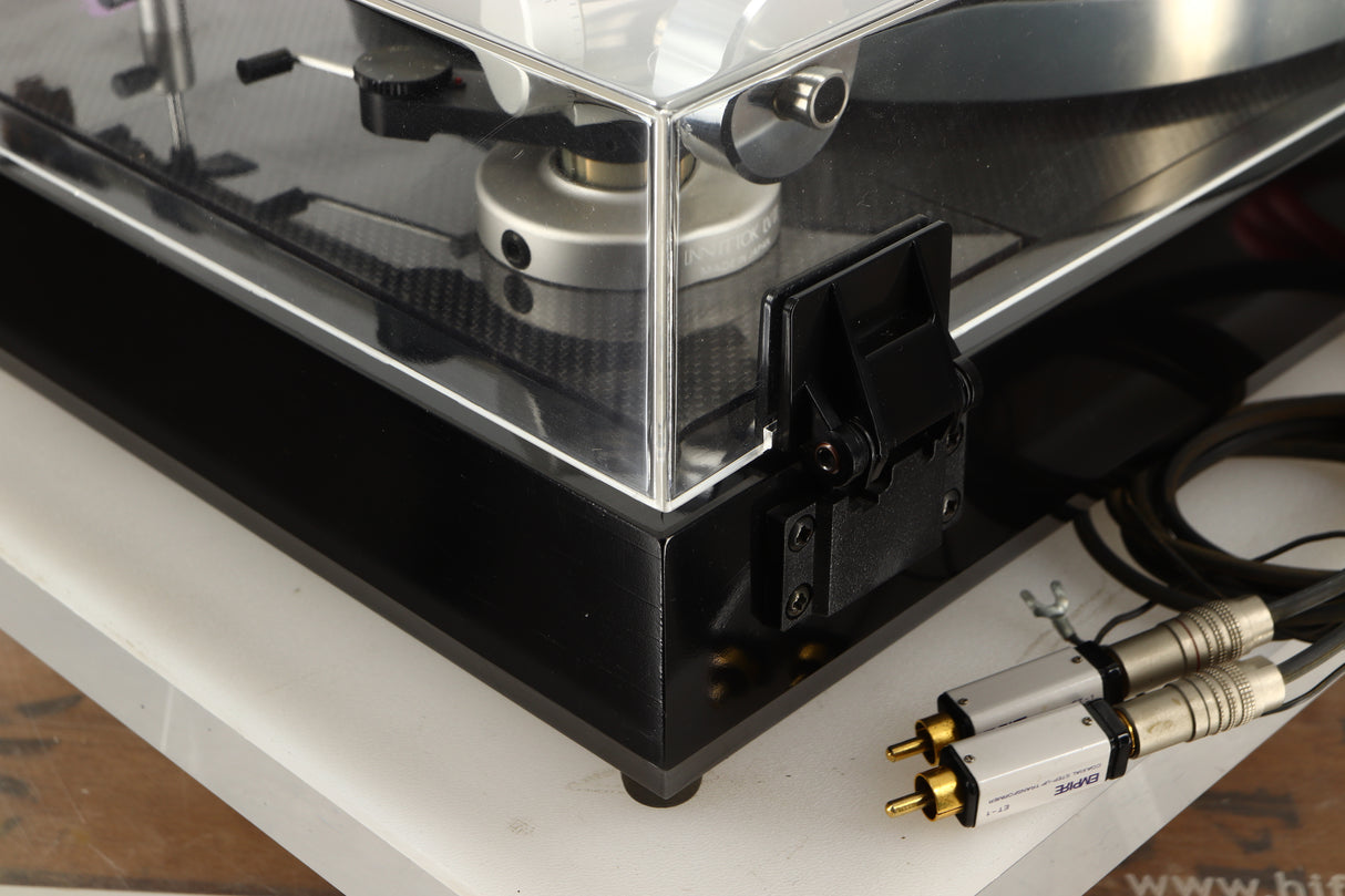 Rear left corner view of a Linn LP12 Turntable in Black Gloss finish with Funk Firm Vector Link Upgrade, Ittok Tonearm, and Dynavector Karat D17D3 Cartridge