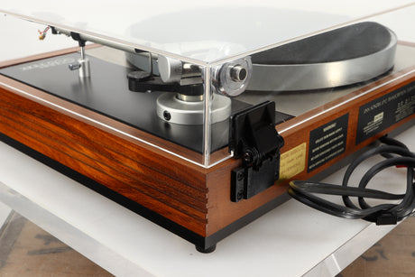 Rear right corner of a used Linn LP12 Turntable / Ittok Tonearm / Hercules Power Supply in a afromosia finish