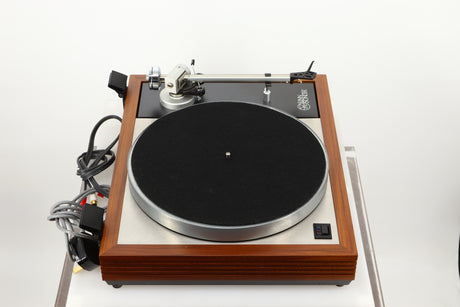 Left side view of a used Linn LP12 Turntable / Ittok Tonearm / Hercules Power Supply in a afromosia finish