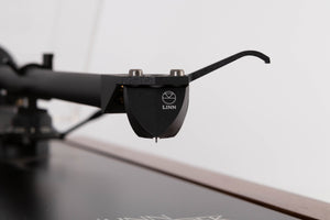 Close up view of a used Linn LP12 Turntable in Afromosia with Akito Tonearm and Adikt Cartridge