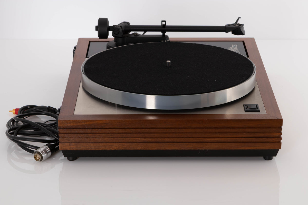 Side view of a used Linn LP12 Turntable in Afromosia with Akito Tonearm and Adikt Cartridge