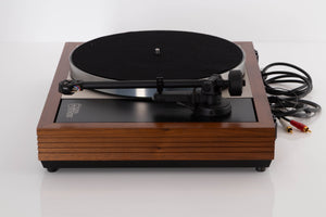 Side view of a used Linn LP12 Turntable in Afromosia with Akito Tonearm and Adikt Cartridge