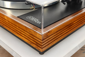 Front right corner view of a used Linn LP12 Turntable in Afromosia finish fitted with a Valhalla power supply board, and an Ekos tonearm 