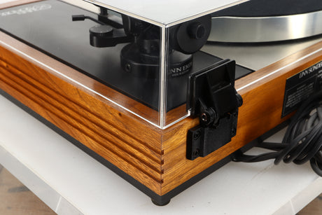 Rear left corner view of a used Linn LP12 Turntable in Afromosia finish fitted with a Valhalla power supply board, and an Ekos tonearm 