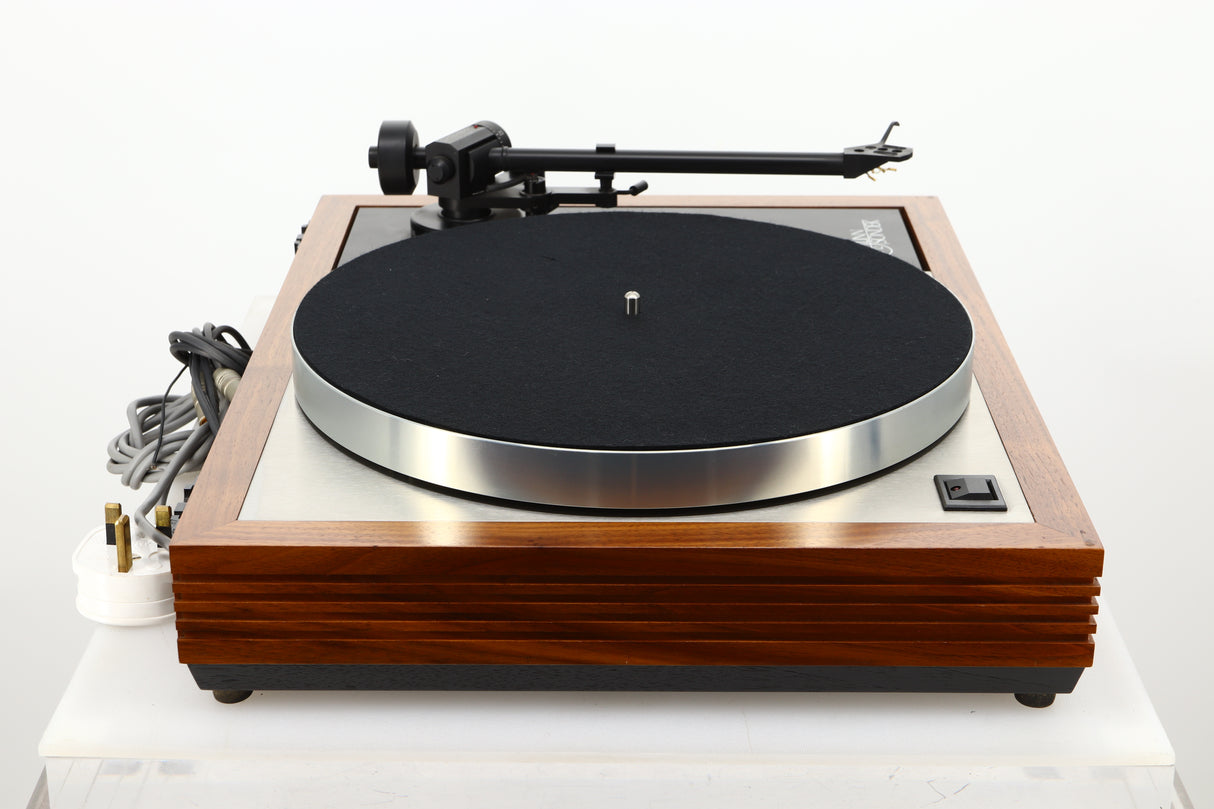 Side view of a used Linn LP12 Turntable in Afromosia finish fitted with a Valhalla power supply board, and an Ekos tonearm 