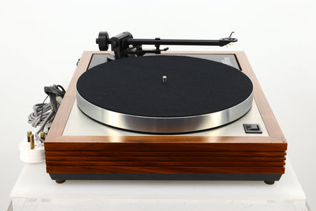 Side view of a used Linn LP12 Turntable in Afromosia finish fitted with a Valhalla power supply board, and an Ekos tonearm 