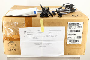 Box for a used Linn Radikal 2 Utopic Turntable Power Supply in a silver finish showing Manual, Mains Cable, Switch, 4x Screws and Motor