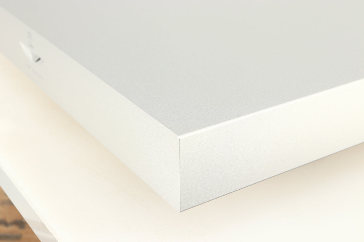 Front right corner of a used Linn Radikal 2 Utopic Turntable Power Supply in a silver finish