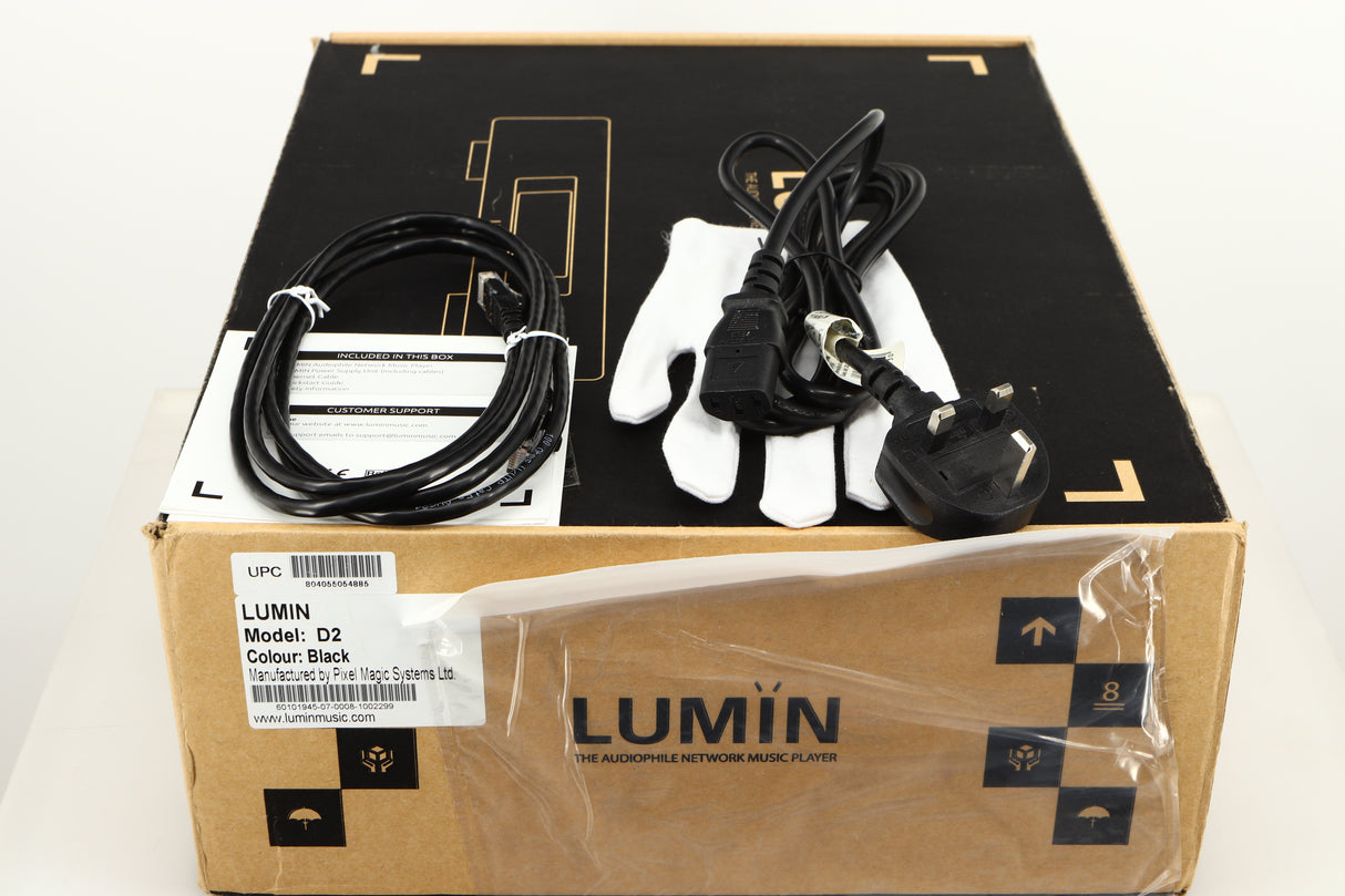 Box for a used Lumin D2 Network Streamer in a black finish showing Mains Cable, Glove, Ethernet Cable and Manual