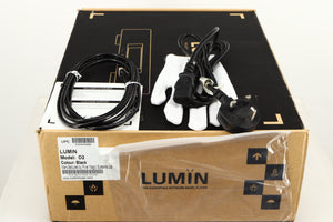 Box for a used Lumin D2 Network Streamer in a black finish showing Mains Cable, Glove, Ethernet Cable and Manual