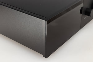 Front left corner of a used Lyngdorf TDAI-1120 Integrated Streaming System in a black finish