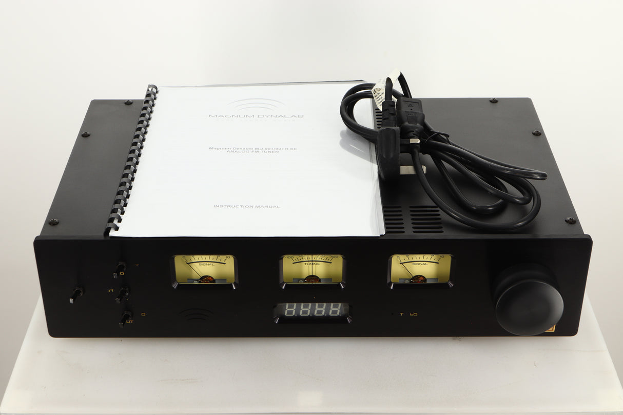 Front view of a used Magnum Dynalab MD90T SE Tuner with mains cable, and manual