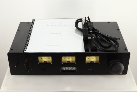 Front view of a used Magnum Dynalab MD90T SE Tuner with mains cable, and manual