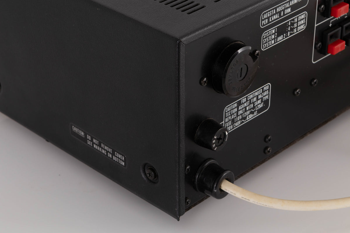 Rear left corner view of a used Marantz 1050 Integrated Amplifier
