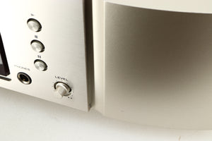 Close up of a used Marantz CD6006 UK Edition CD Player in a silver finish showing small nick on fascia