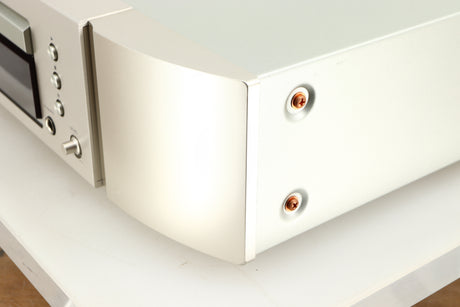 Front right corner of a used Marantz CD6006 UK Edition CD Player in a silver finish