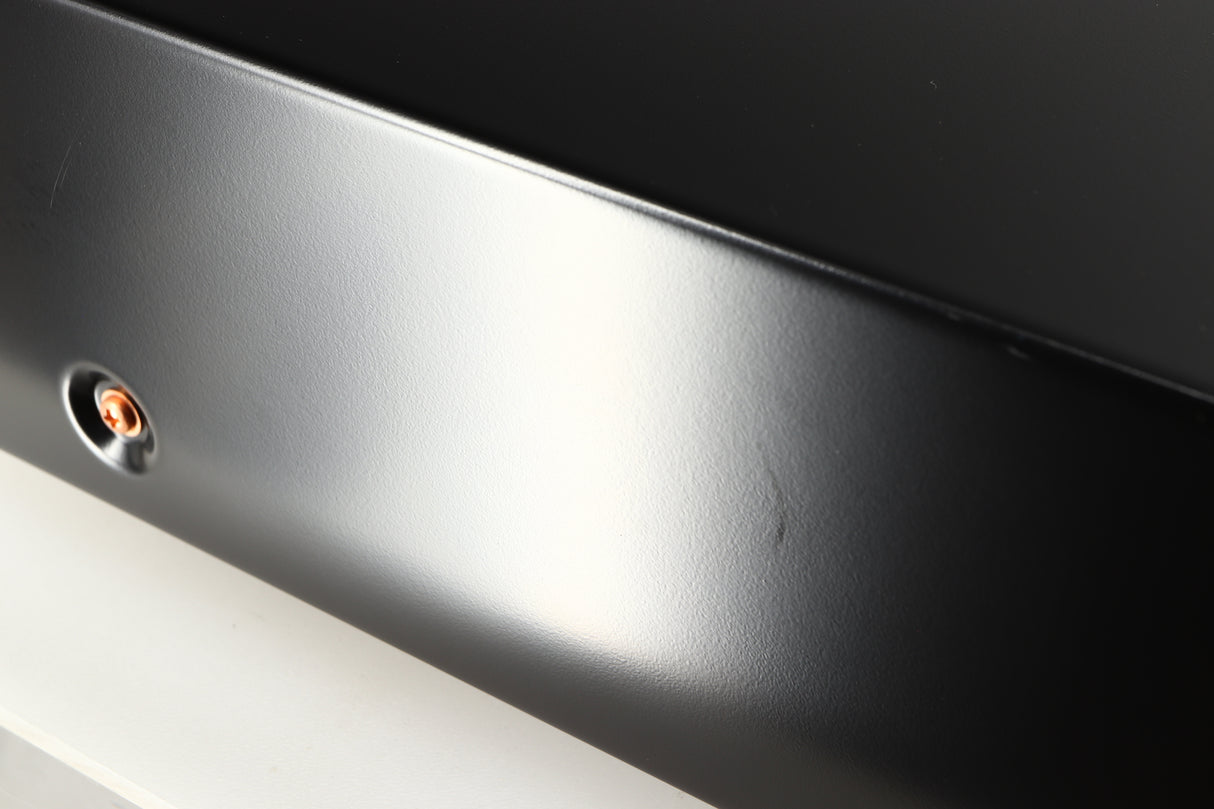 Close up of a used Marantz CD6007 CD Player in a black finish showing some scratching