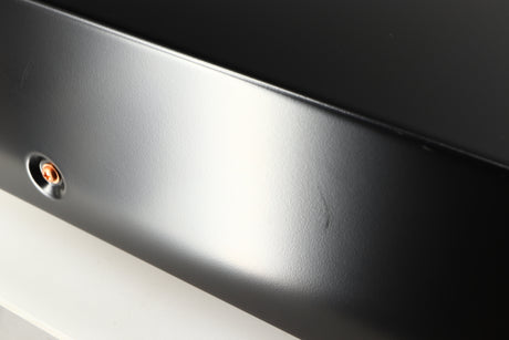Close up of a used Marantz CD6007 CD Player in a black finish showing some scratching