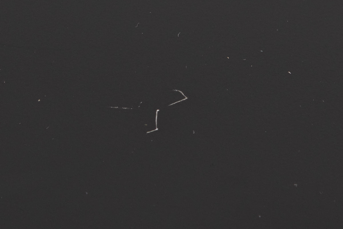 Close up of a used Marantz CD6007 CD Player in a Black finish showing scratches on top